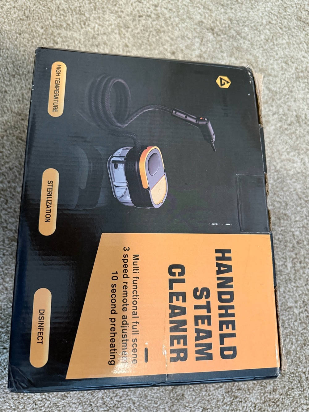 Handheld Steam Cleaner - Black and Orange Home or car cleaner.